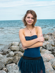  Belarusian brunette beauty Yelena wanders along a rocky shoreline