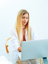 Hot blonde Lisa Dawn sits at her laptop