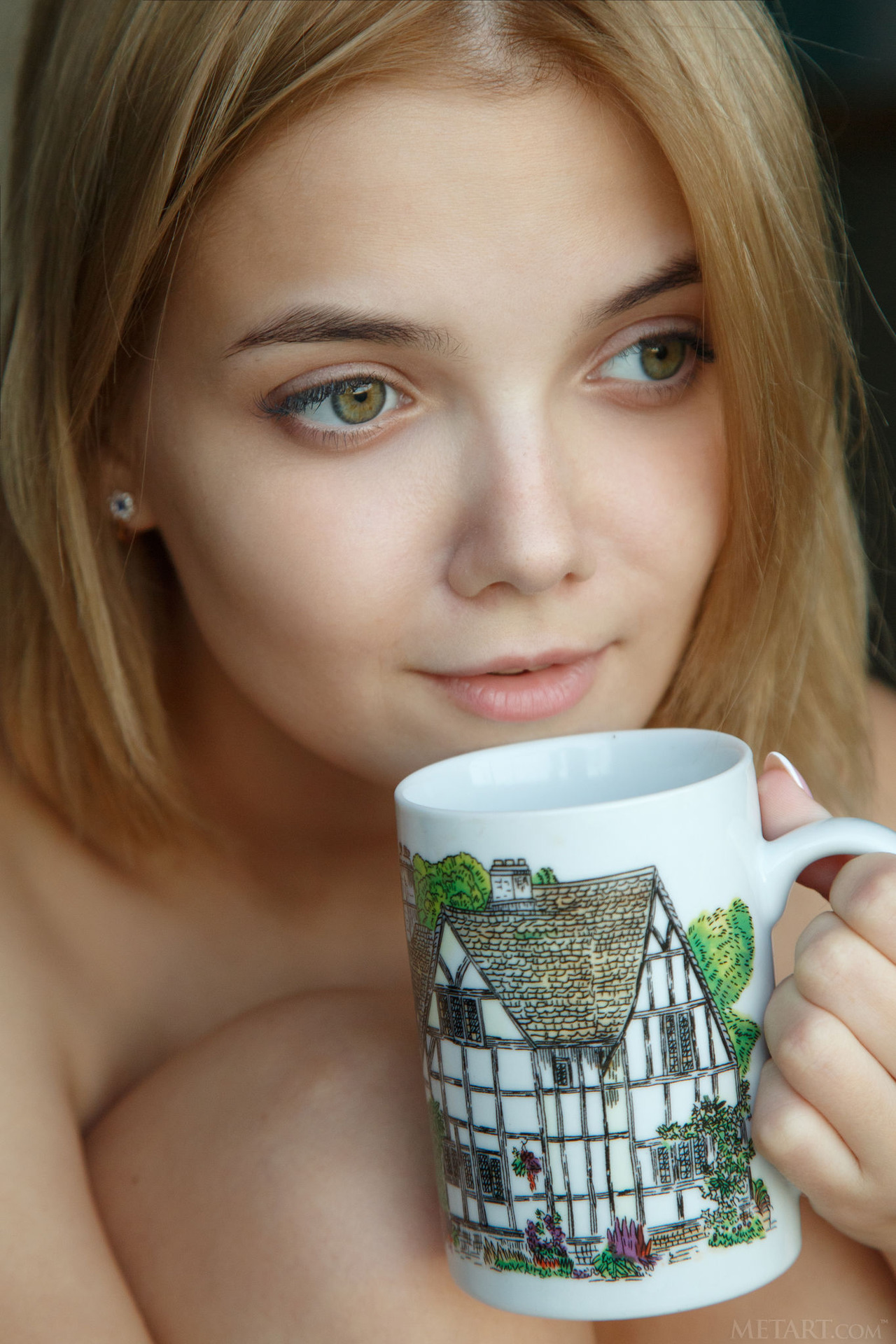 Stunning blonde Chanel Fenn sips her tea on the balcony 20