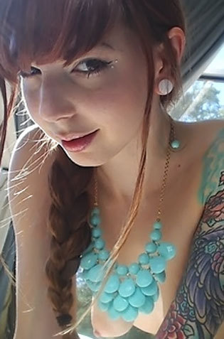 Tattoed Redhead Babe Showing Her Inked Skinny Body